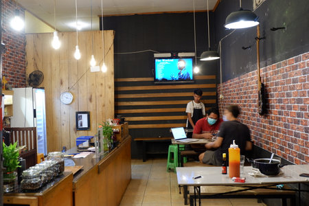 Kutai Barat, Indoensia - January 13, 2021: Professional coffee brewing staff in a beautiful and modern interiorのeditorial素材