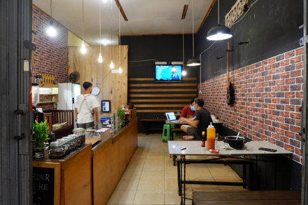 Kutai Barat, Indoensia - January 13, 2021: Professional coffee brewing staff in a beautiful and modern interiorのeditorial素材