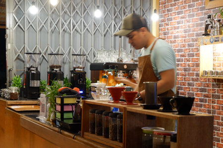 Kutai Barat, Indoensia - January 13, 2021: Professional coffee brewing staff in a beautiful and modern interiorのeditorial素材