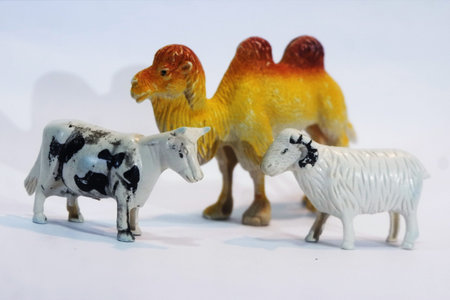 Toys Animal, cow, sheep, and camel in different poses isolated on white background