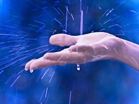 hand with a raindropsの写真素材