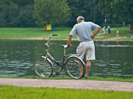 Old man with his bicycleの写真素材
