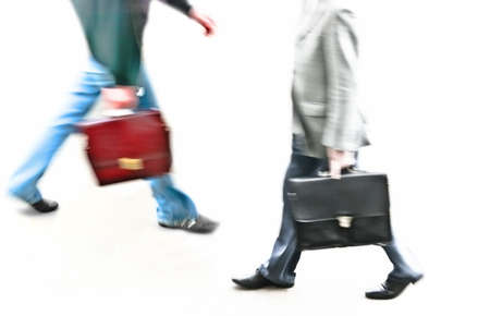 two different buisnessman in blurry walkingの写真素材