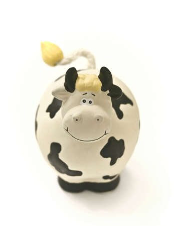 Souvenir or moneybox, smiling cow, isolatedの写真素材