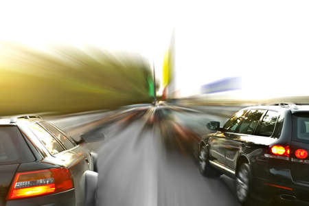 two sport-cars in blurry motionの写真素材