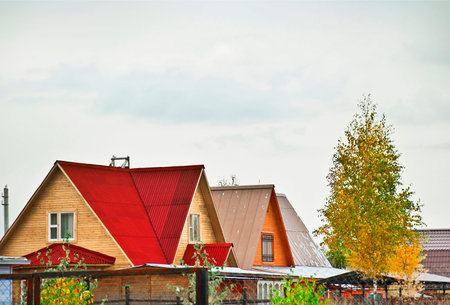 wooden cottages at autumnの写真素材