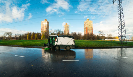 cityscape with the street cleaning machine