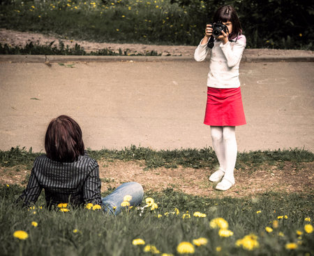 daughter photographing mother outdoorのeditorial素材