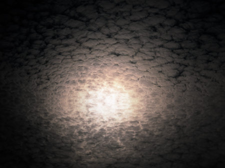 moon behind cloudsの写真素材