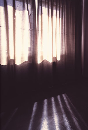 curtained window in room