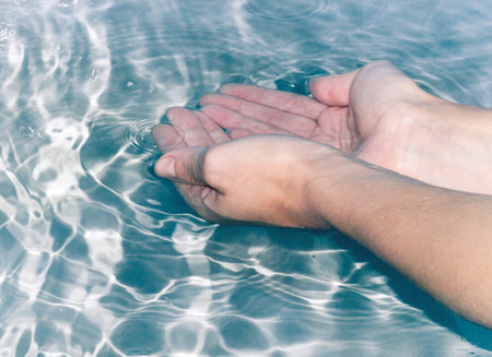 hands in water