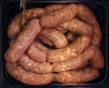 small sausages in container