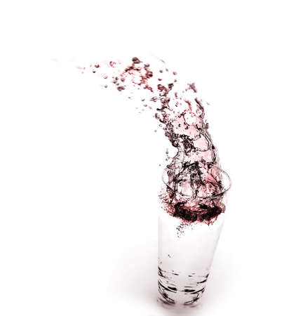 wine splashing in glassの写真素材