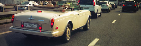 Moscow, Russia: Rolls-Royce Corniche II Convertible Coupe (since 1971) moves in the city traffic jam (PS fake license plate)のeditorial素材