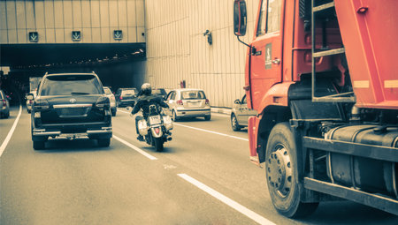 Russia, 2012: motorcyclist maneuvering in dense city traffic