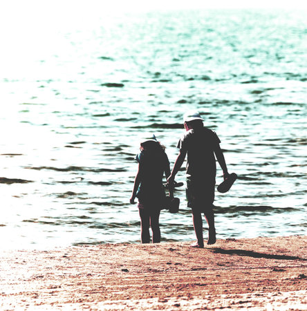 pair of children on sandy beach