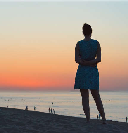 woman posing at sea sunsetの写真素材