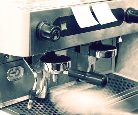 pouring coffee from the coffee machineの写真素材