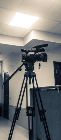 videocamera stands in room interiorの写真素材