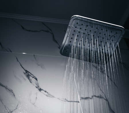 shower head in bathroom at darkの写真素材