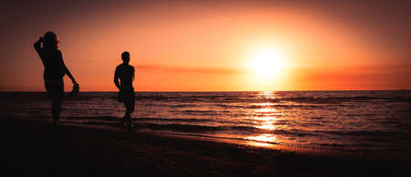 couple at the sunset beachの写真素材