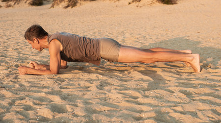 plank exercise on sandy beach