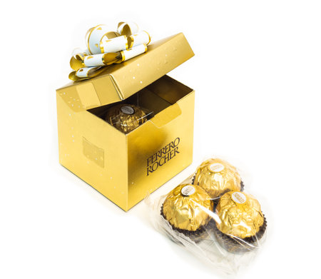 2021: the Ferrero Rocher chocolate-nut sweets in the gift box are on white backgroundのeditorial素材
