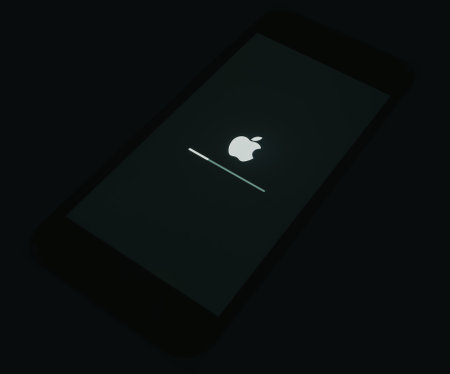 2020: iOs loading at the Apple iPhone Black start screen, isolated in darknessのeditorial素材