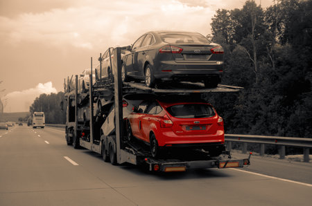 Moscow, Russia - August 18, 2012: Fords Focus and Mondeo new cars delivering on transporter trailer to dealersのeditorial素材