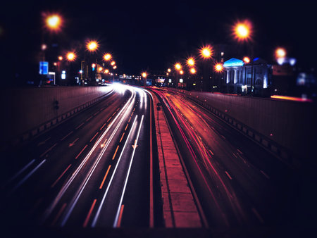 city highway blurry traffic at night warm illumination