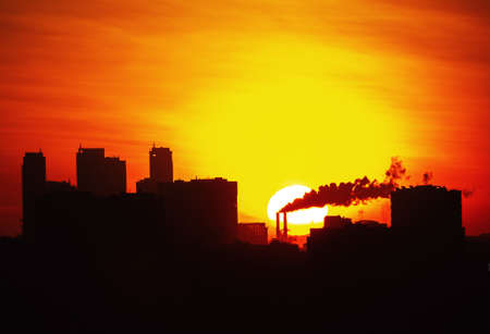 urban cityscape silhouette at fiery sunriseの写真素材