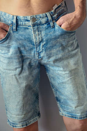 man dressed new aged denim shorts closeupの写真素材