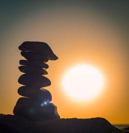 beach pebble stones pyramid on sea shoreのイラスト素材
