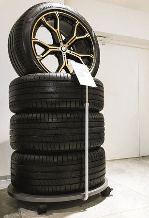 2022: New BMW car wheels with mounted the low-profile Pirelli tires in showroomのeditorial素材