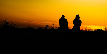 couple in the field at sunset