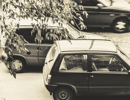 small class cars on autumnal street