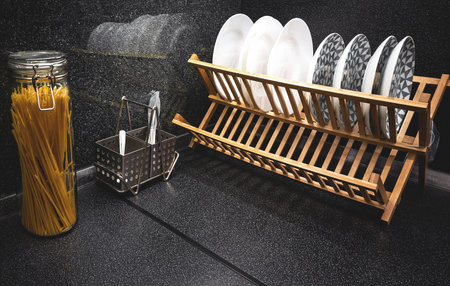 utensils on black angular kitchen topの写真素材