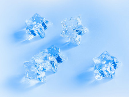 cold winter theme with icy stars on snow
