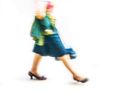 woman in stockings and skirt, walking outdoors