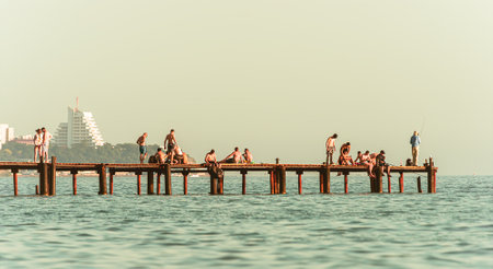 Black Sea in Anapa, Russia. beachcombers people on old pierの写真素材