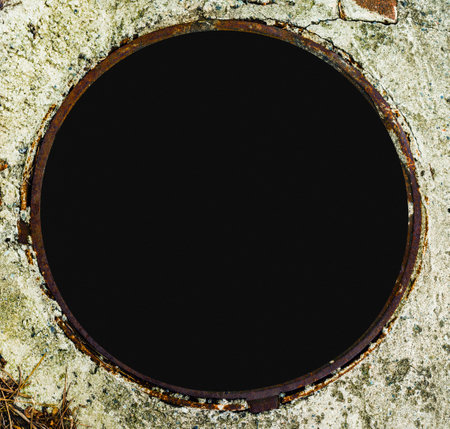 black hole of the open sewage collector manholeの写真素材