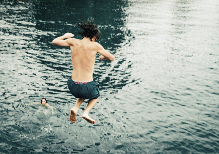 young man have extremal high water jumping