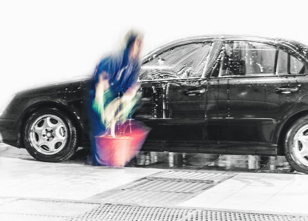 manual car wash service; blurry motionの写真素材