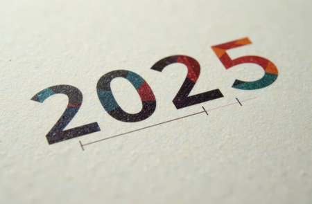 Colorful numbers representing the year 2025 are displayed prominently against a textured paper background. The visual represents creativity and optimism for the upcoming year..の素材