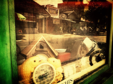 Mirror image of shops across the road