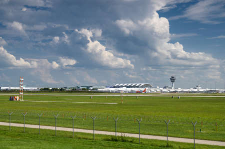 Munich, Germany - September 01, 2019: View of Terminal 1 and the tower of Munich Airport. In the foreground of the northern runwayのeditorial素材