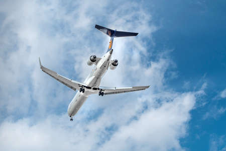 Munich, Germany - March 25. 2019: Lufthansa CityLine Bombardier CRJ-900LR with the aircraft registration D-ACKE in the approach to the northern runway of the Munich airport MUC EDDMのeditorial素材