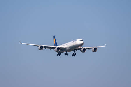 Munich, Germany - March 31. 2019: Lufthansa Airbus A340-642 with the aircraft registration D-AIHW in the approach to the southern runway 08R of the Munich Airport MUC EDDMのeditorial素材