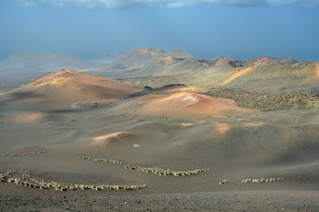 View of volcanic landscape in Valle del Silencio, Valley of Silence in Timanfaya National Park in Lanzarote, Canary Islands, Spainの写真素材