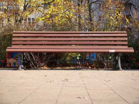 A brown park benchのeditorial素材